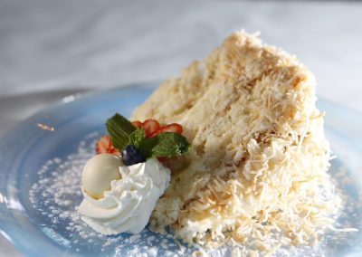 Close up slice of cake with coconut