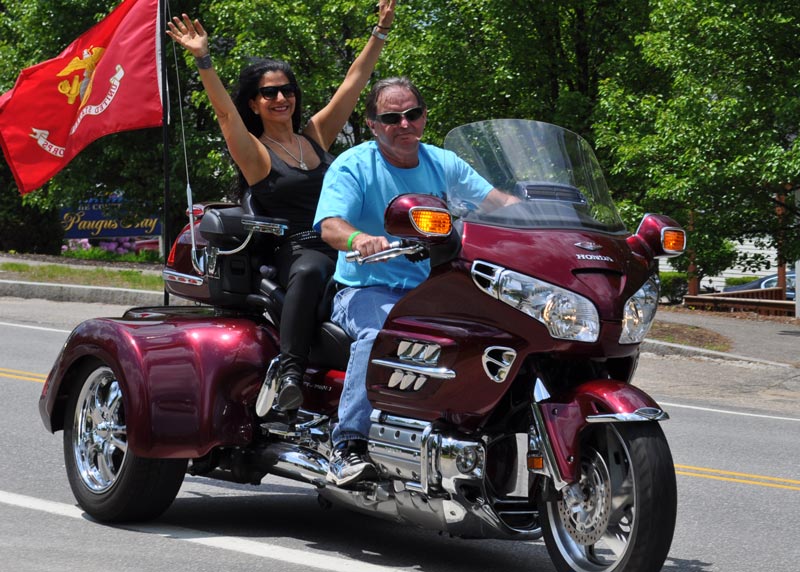 Cynthia Makris riding on a motorcycle.