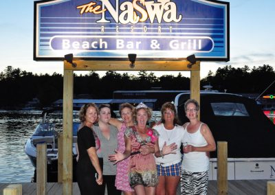 Group of ladies under the NASWA Resort dock sign.
