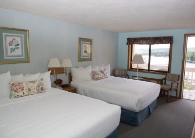 Inn bedroom with two queen beds.
